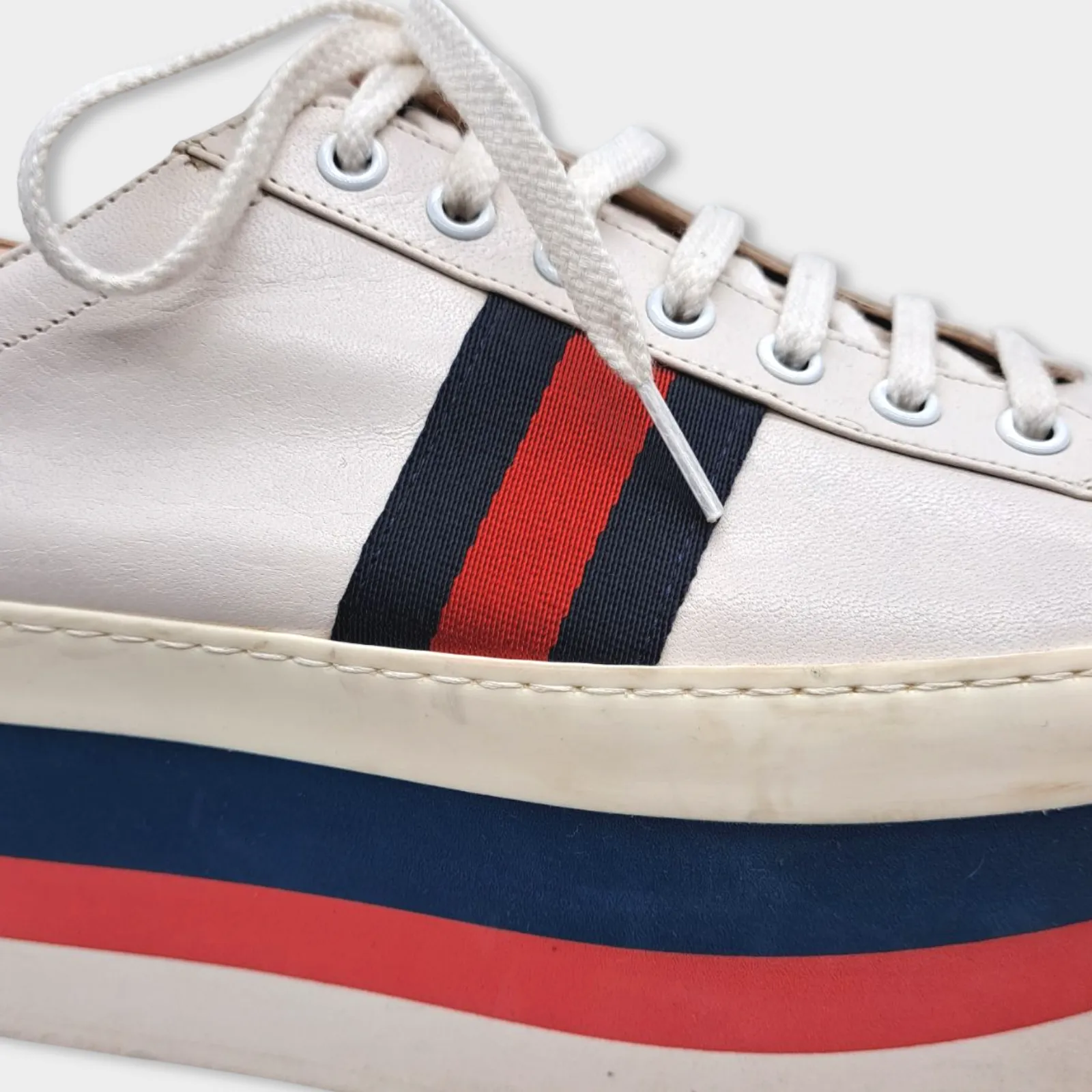 Gucci women's white leather platformed sneakers with red and navy accents